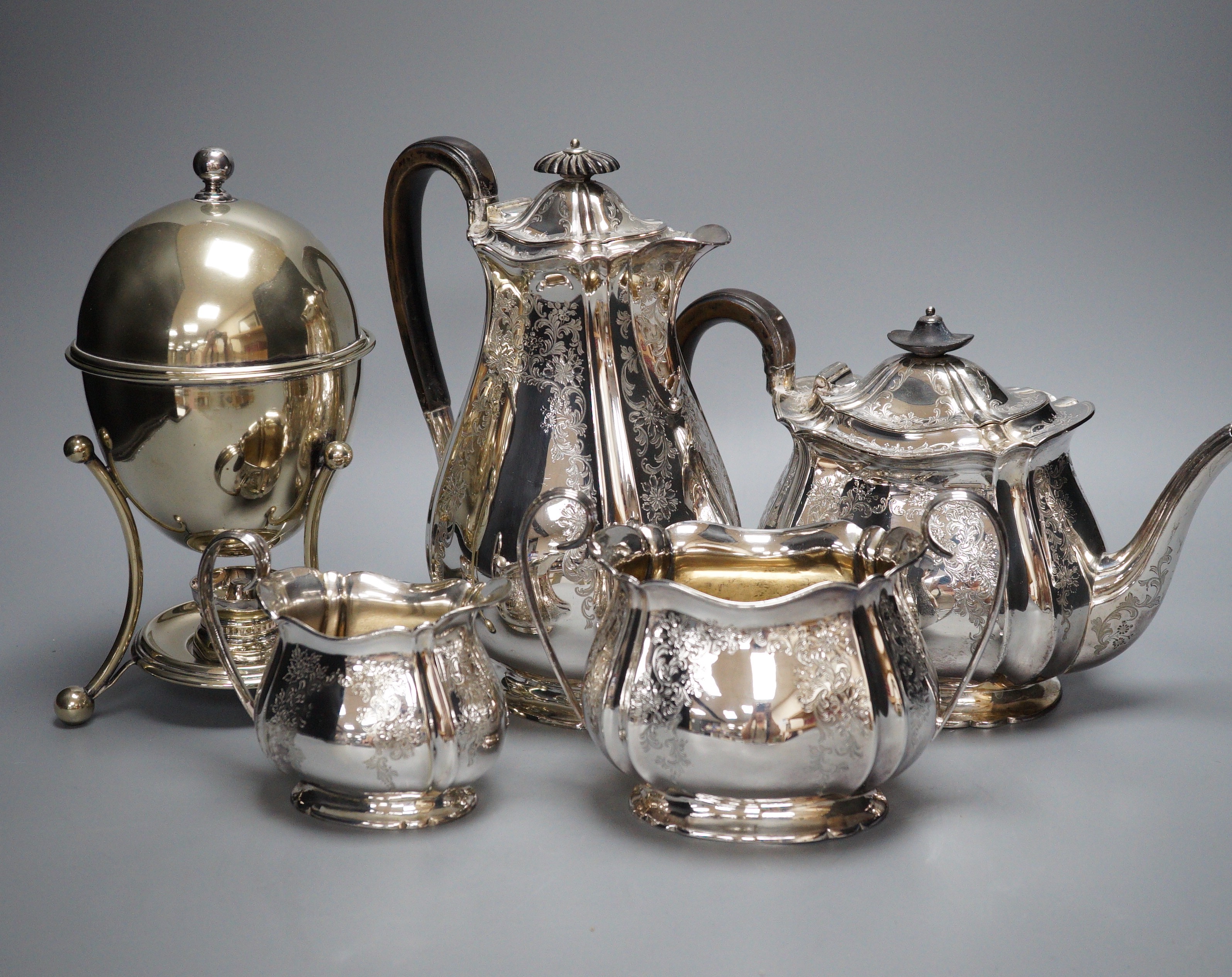 A canteen of silver plated cutlery, a four piece plated tea set and a plated egg coddler.